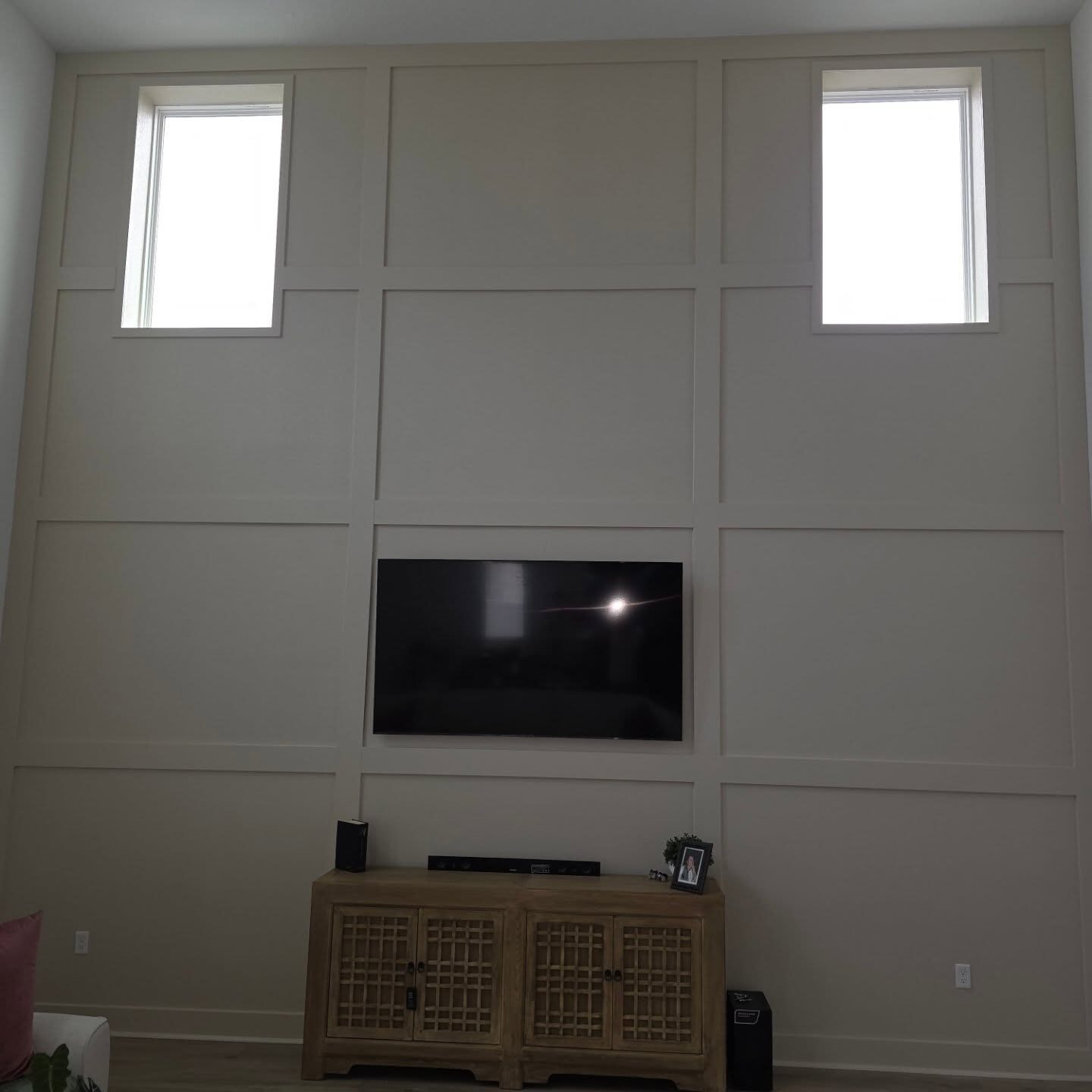 Two-Story Feature Wall after in Mount Dora: full-height board-and-batten grid, trim and paint